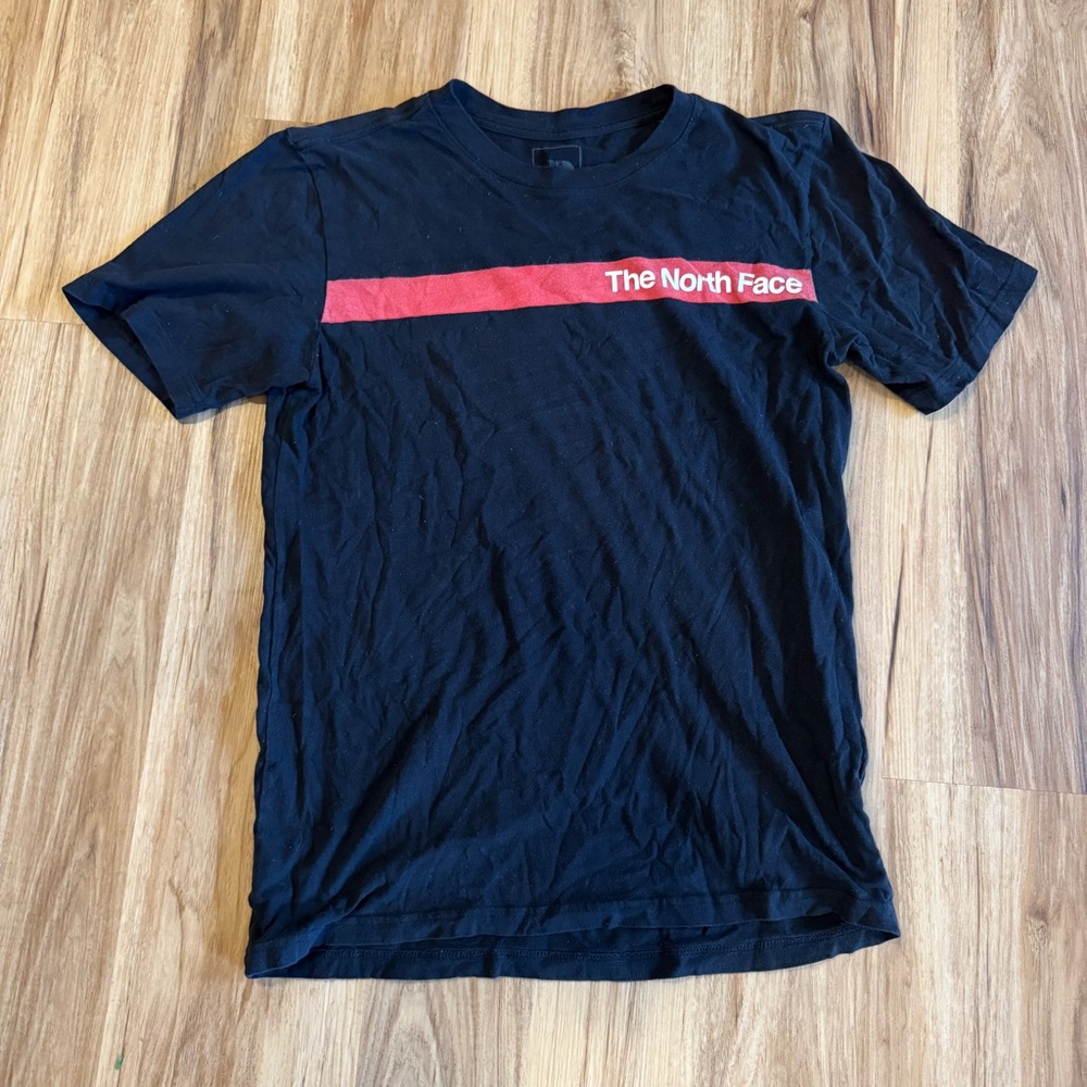The North Face Black Tee with Red Chest Stripe and White Logo Text